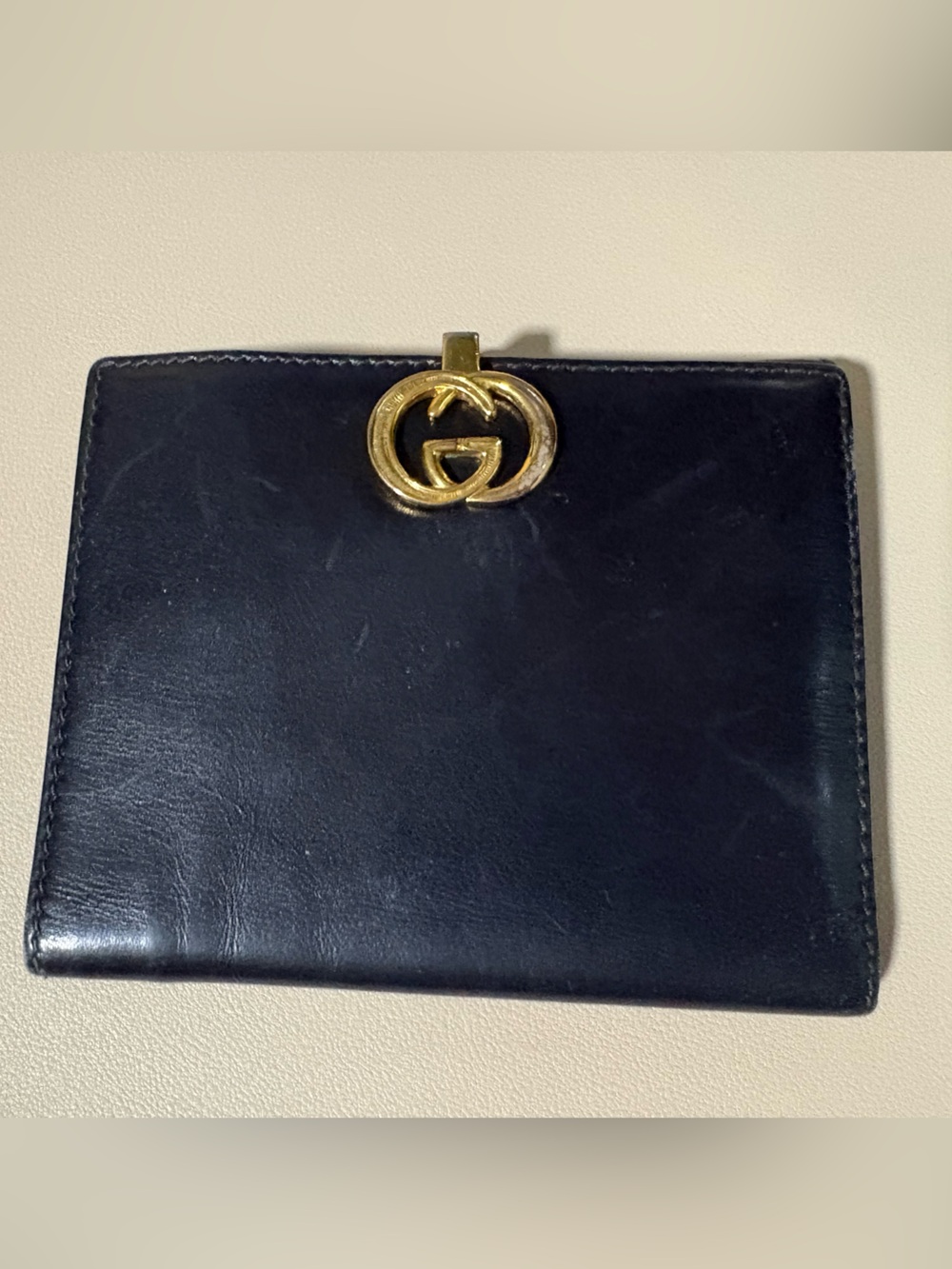 Black Leather Gucci Wallet with Gold Accent